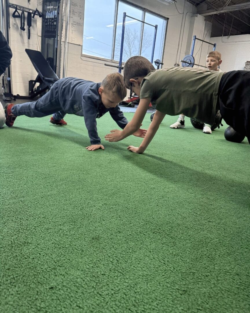 Young athlete practicing proper deadlift form with light weight during teen strength training at The Well Bowling Green